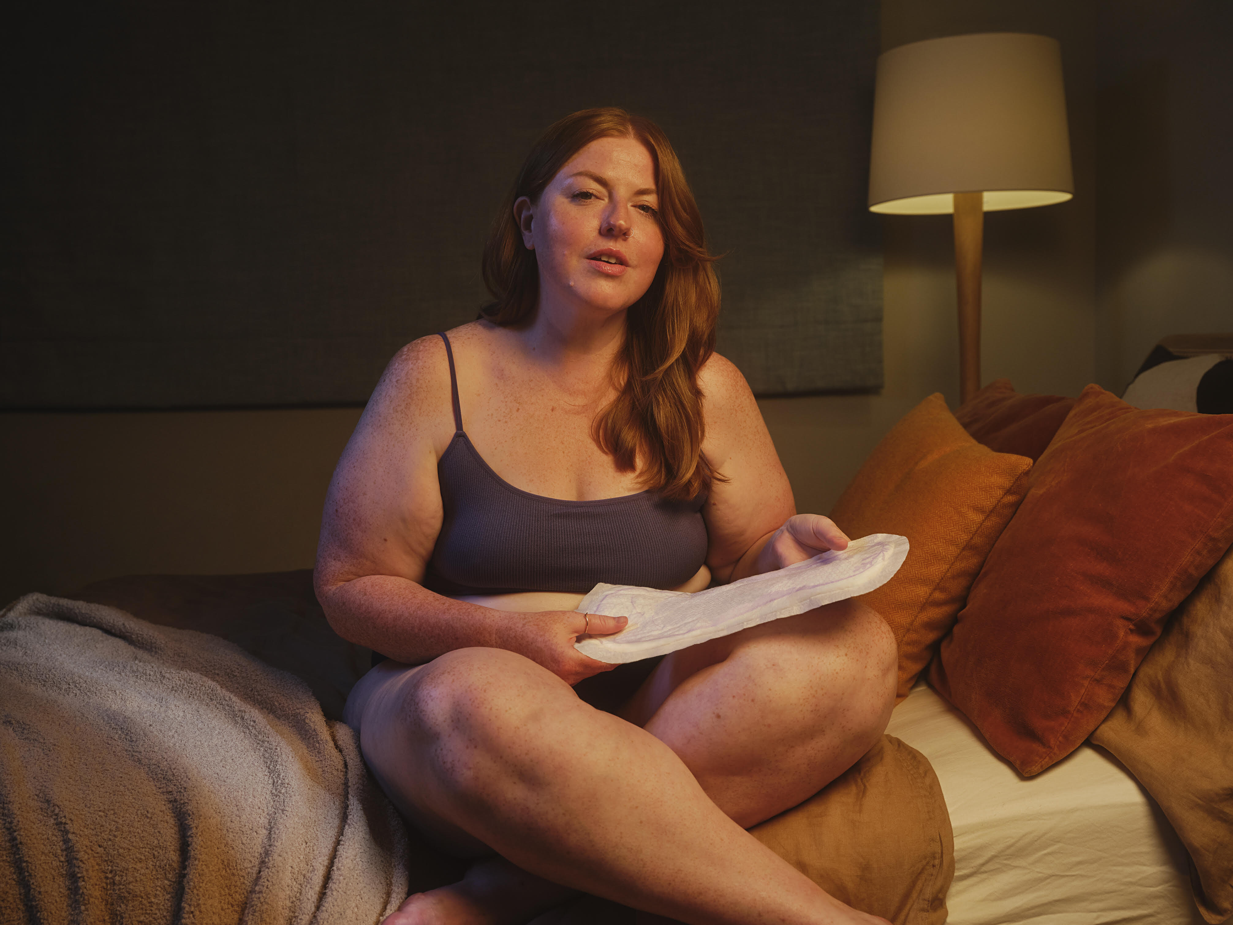woman holding a pad woman holding a pad